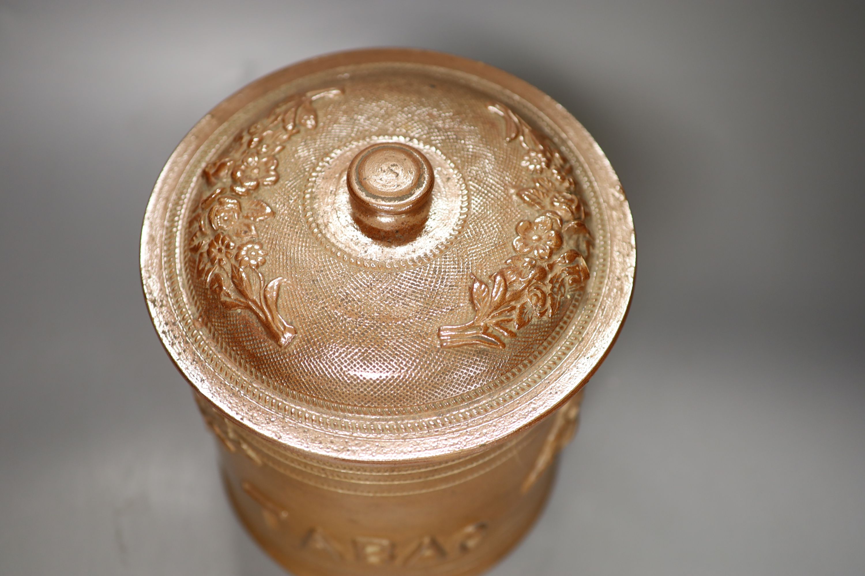 A French stoneware tobacco jar and cover, overall 26cm